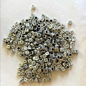 CONTAINER OF ALPHABET BEADS, Silvertone